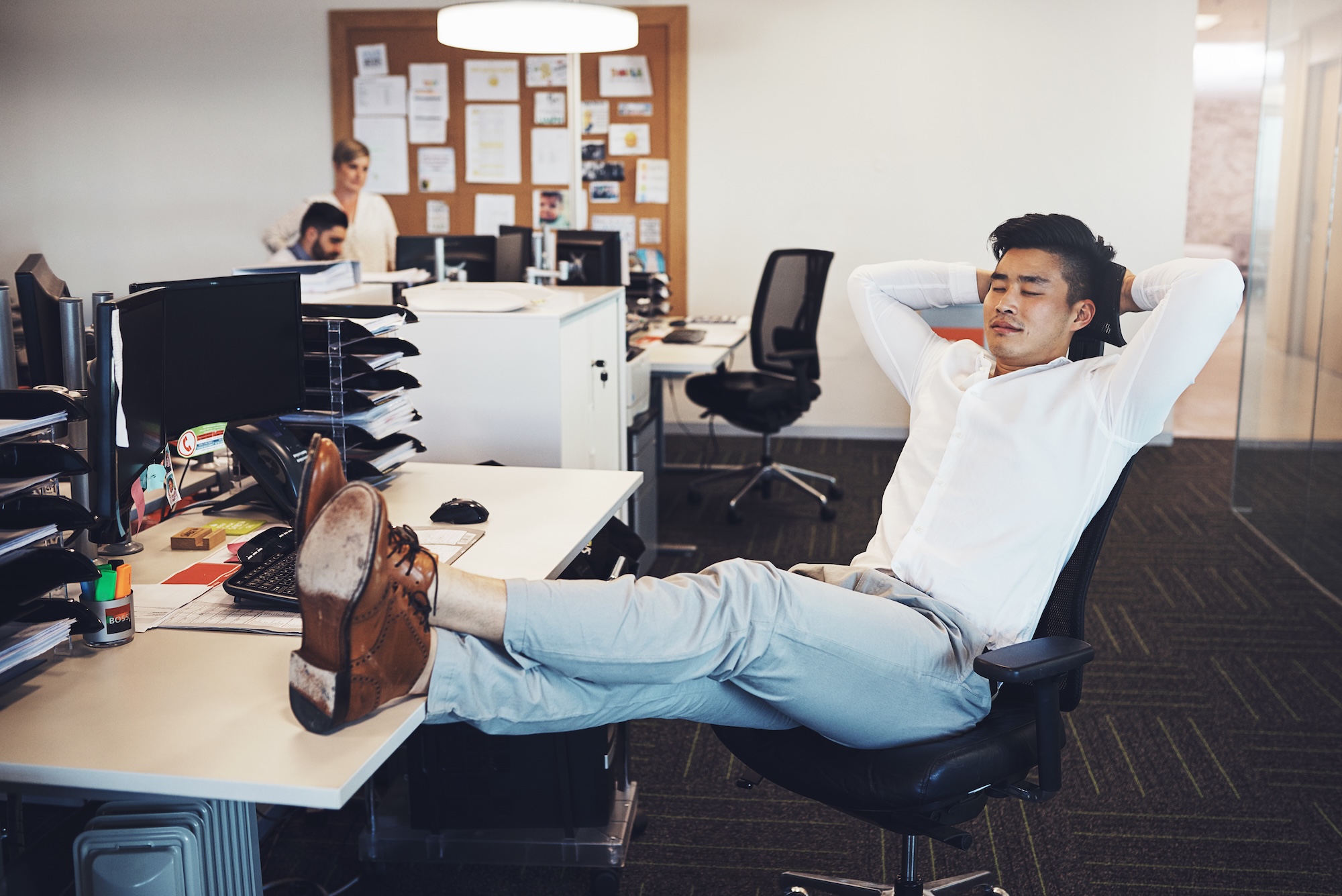 Time to take a break. Shot of a businessman taking a break in the office